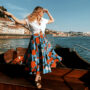 Monica standing on a wooden platform overlooking the Portugal coast