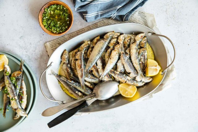 travel to portugal and eat a traditional sardine dinner 