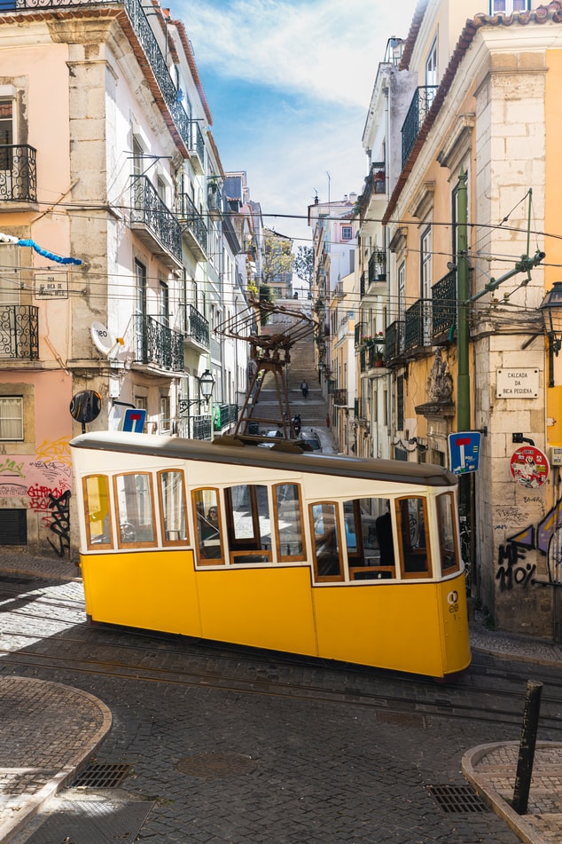 yellow street car in lisbon portugal