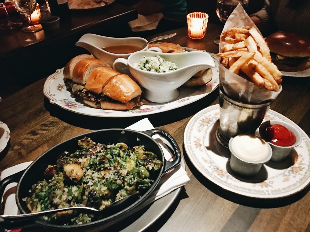 sides from 4 Charles Prime Rib; kale salad;fries;and a sandwich in the back