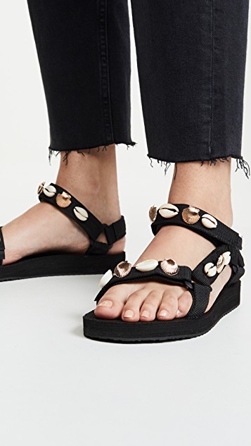 black sandals with puka shells on the straps; piece for summer wardrobe