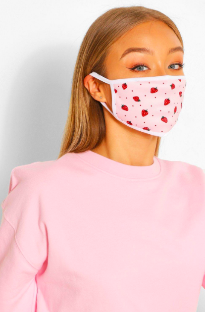 fruity fashion pick pink face mask with small strawberry and red dot print worn
