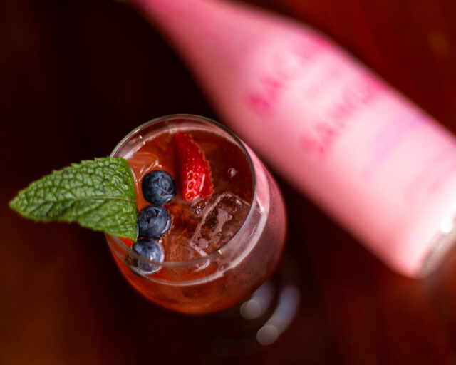 Sparkling Rosé Cocktail with Bacana, blueberries, strawberries, and mint